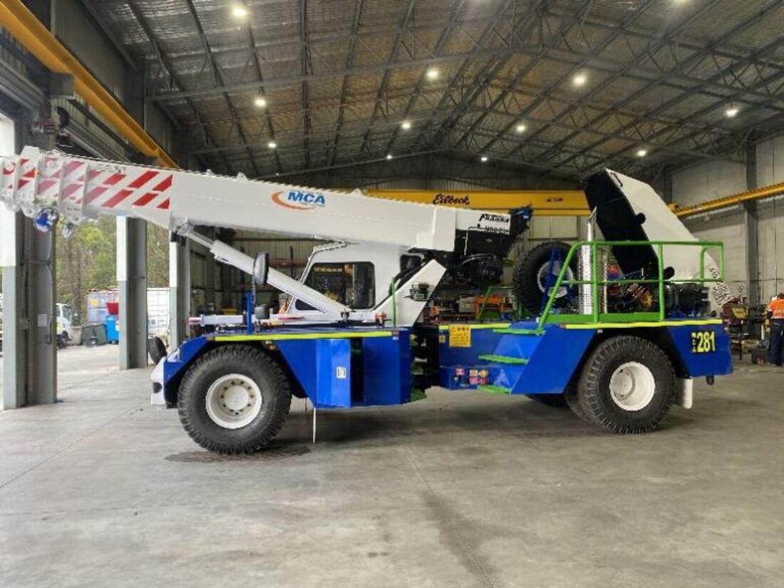 Terex Franna pick and carry crane inside a workshop